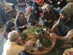 Making salad at Greater Goods