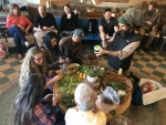 Making salad at Greater Goods