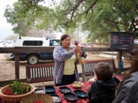Julie singing with Chumash gourd rattle